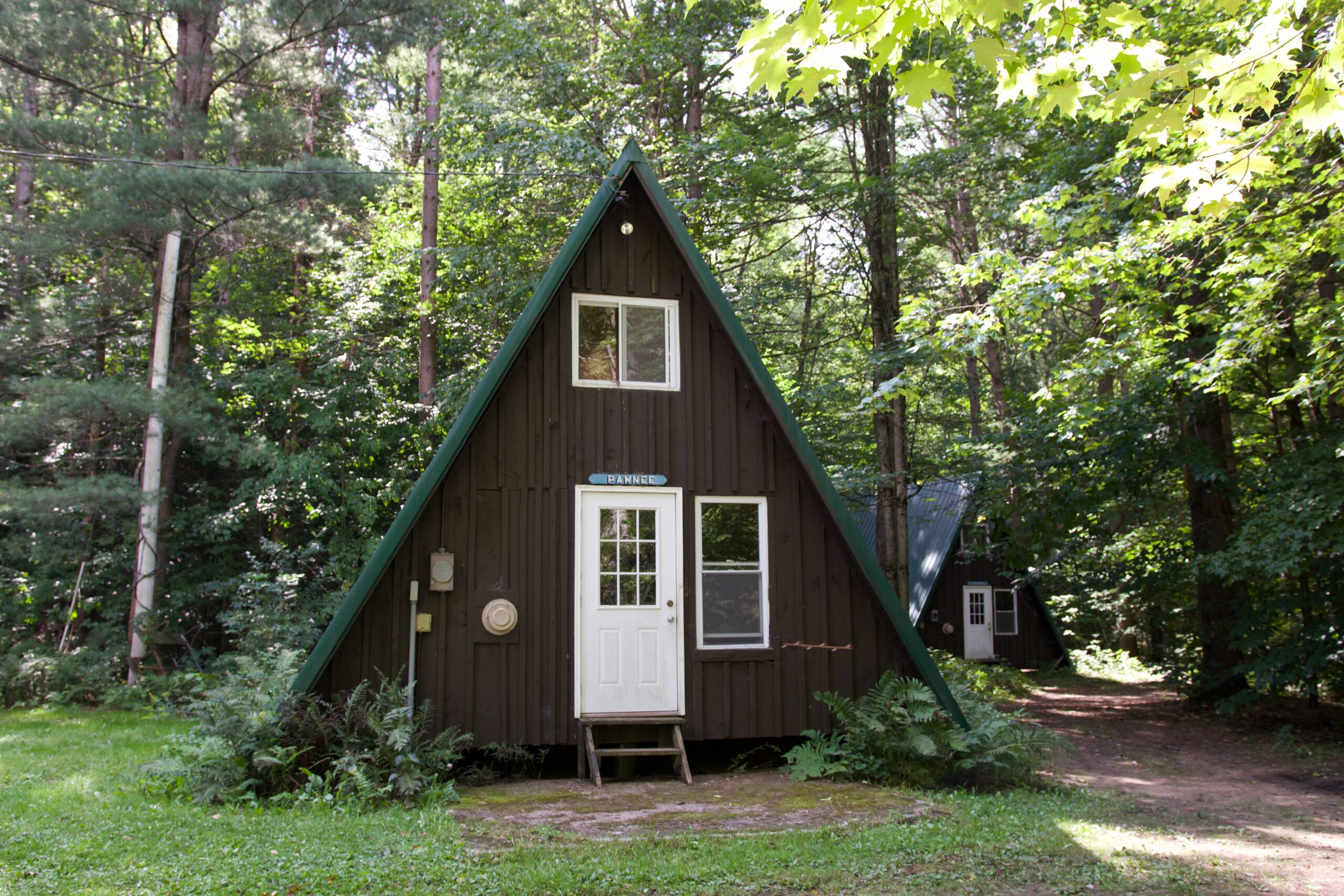 We have indoor sleeping for 30 people between 3 A-Frame cabins, located at the beginning of Camp Kingsley. These buildings offer heated sleeping space with electric plugs. Beds in these a-frames are first-come, first-served. During warmer months they also have bathrooms with showers.